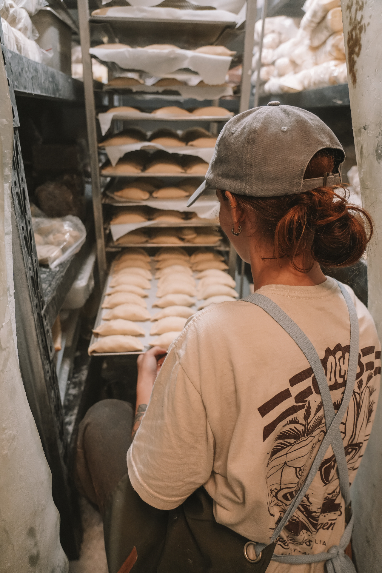 Fresh empanadas being prepared on trays in the Pocha kitchen